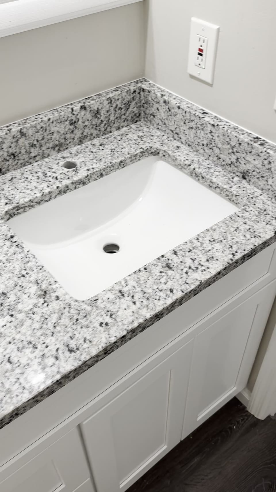 Undermount sink under a granite vanity top