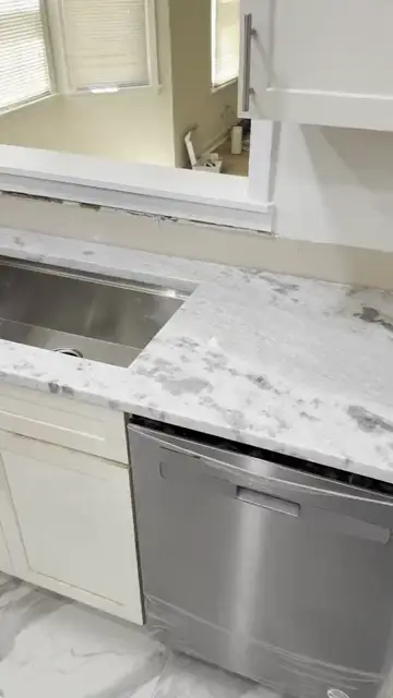 Bold veined L shaped counter, install day