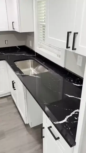 Black veined countertop with an undermount sink