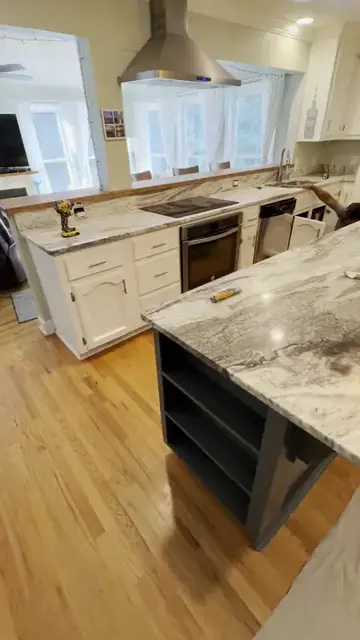 Gray veined island with open shelving